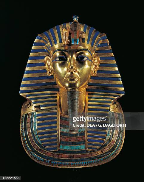 Egyptian civilization, Old Kingdom, Dynasty XVIII. Golden funerary mask of Tutankhamun inlaid with lapis lazuli, obsidian and turquoise.