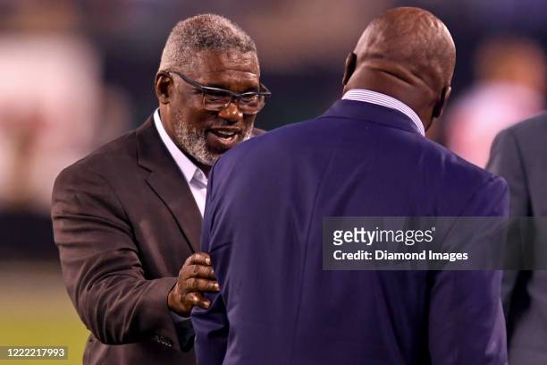 Executive Vice President of Football Operations Alonso Highsmith of the Cleveland Browns talks with Monday Night Football commentator Booger...