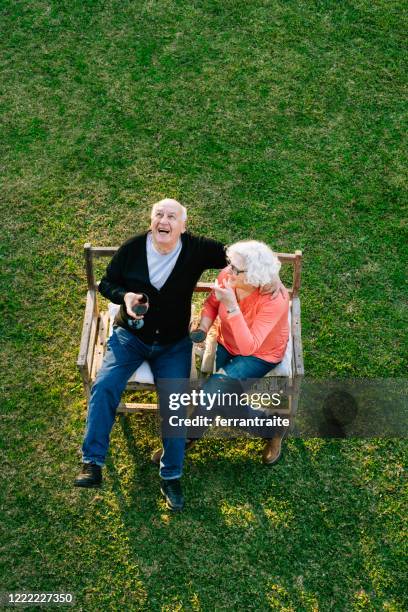 senior couple enjoying the garden - argentina wine stock pictures, royalty-free photos & images