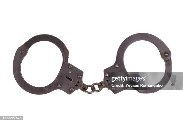 handcuffs isolated on white background - handcuffs stock pictures, royalty-free photos & images