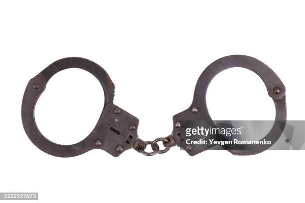 handcuffs isolated on white background - handcuffs imagens e fotografias de stock