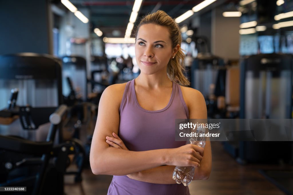 Beautiful Woman At The Gym Holding A Water Bottle High-Res Stock Photo -  Getty Images
