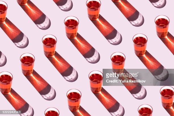 top view of glasses on the pink background - drink stock-fotos und bilder