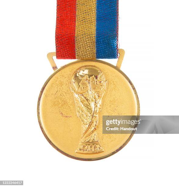 This handout image provided by Julien’s Auctions shows a 2002 FIFA World Cup gold winner's medal awarded to a player from the champion Brazil...