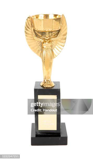 This handout image provided by Julien’s Auctions shows a Jules Rimet replica trophy presented to Marco Antônio Feliciano during the 1970 World Cup...