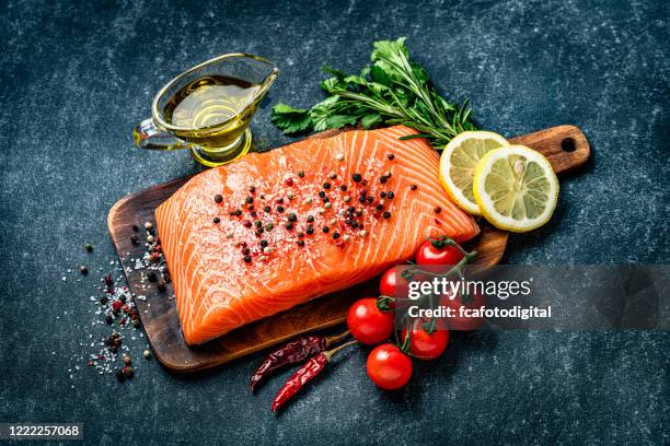 raw salmon fillet with ingredients - rustic salmon fillets stock pictures, royalty-free photos & images