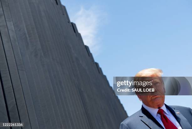 President Donald Trump participates in a ceremony commemorating the 200th mile of border wall at the international border with Mexico in San Luis,...