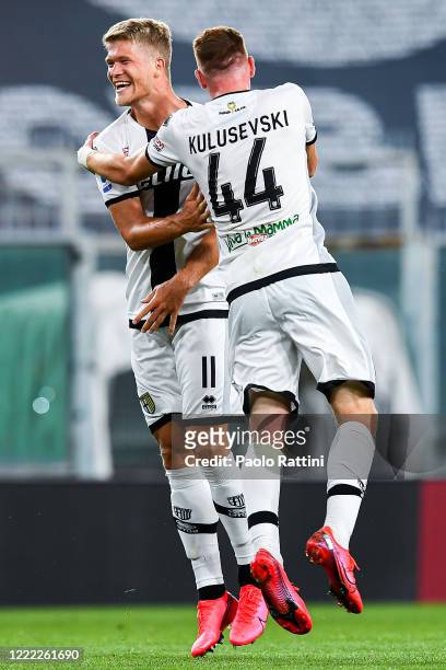 Andreas Cornelius of Parma celebrates with Dejan Kulusevski after scoring a goal during the Serie A match between Genoa CFC and Parma Calcio at...