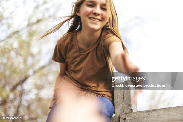 farm life with two teenage sisters in western usa - girl reaching stock pictures, royalty-free photos & images