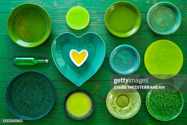 home inventory all in green crockery plates on green wooden background heart shape - healthy plate method stock pictures, royalty-free photos & images