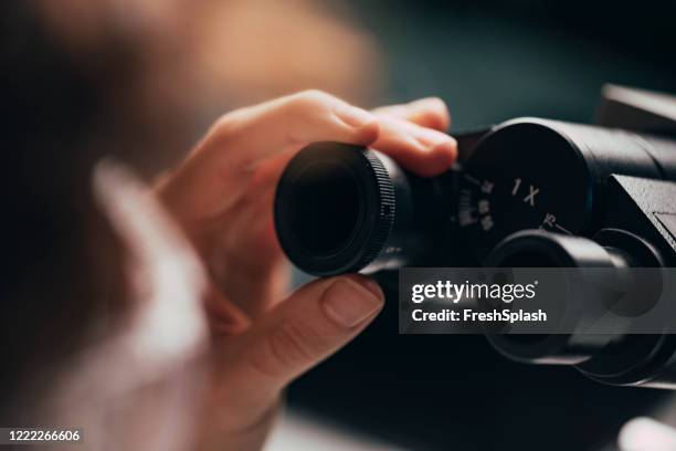 microscope ocular adjustment, a close up - hand adjusting stock pictures, royalty-free photos & images