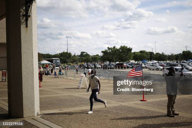 Person runs toward the entrance of a polling location before the 6pm deadline to vote in Louisville, Kentucky, U.S., on Tuesday, June 23, 2020....