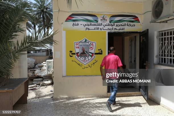 Palestinian man enters the Fatah movement offices in the West Bank city of Jericho on June 21, 2020. - When Israeli Prime Minister Benjamin Netanyahu...