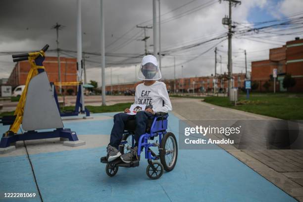 Year-old Steven Tao Lozano suffering from Duchenne muscular dystrophy which causes progressive muscle degeneration and weakness, poses for a photo...