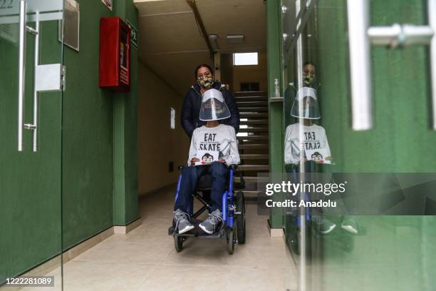 Year-old Steven Tao Lozano suffering from Duchenne muscular dystrophy which causes progressive muscle degeneration and weakness, is being taken out...