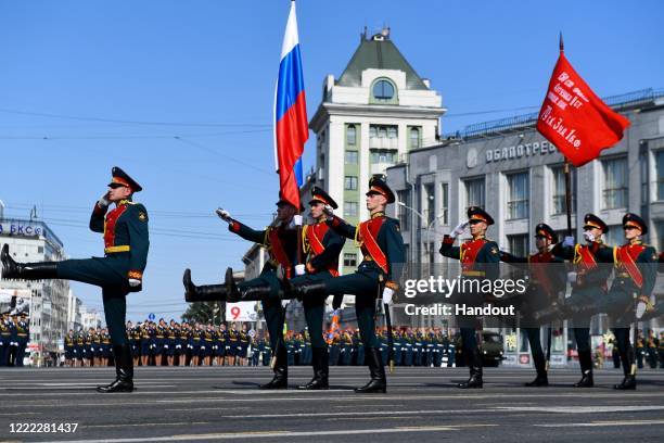 Servicemen march across Lenin Square in Novosibirsk during a military parade to commemorate the 75th anniversary of Victory in World War II, on June...