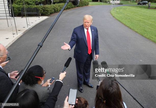 President Donald Trump talks to journalists on the South Lawn while departing the White House for Camp David May 01, 2020 in Washington, DC....