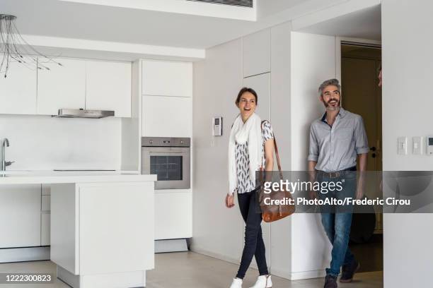 couple looking new house - couple in surprise stock pictures, royalty-free photos & images