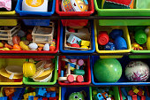 A variety of childrens toys in bins