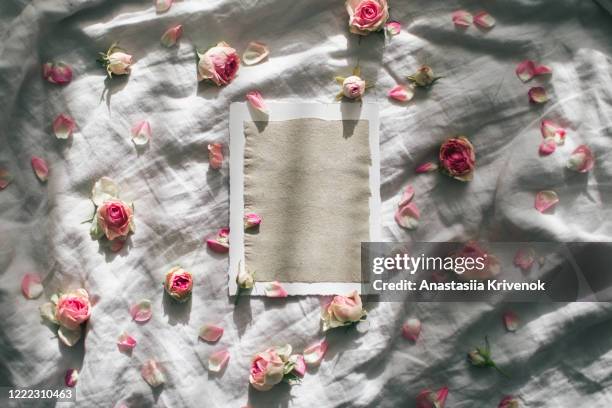 floral pattern made of pink roses on grey lonen background. flat lay, top view. creative floral layout or greeting card for mothers day, wedding , happy event or birthday. - wedding symbols stock pictures, royalty-free photos & images