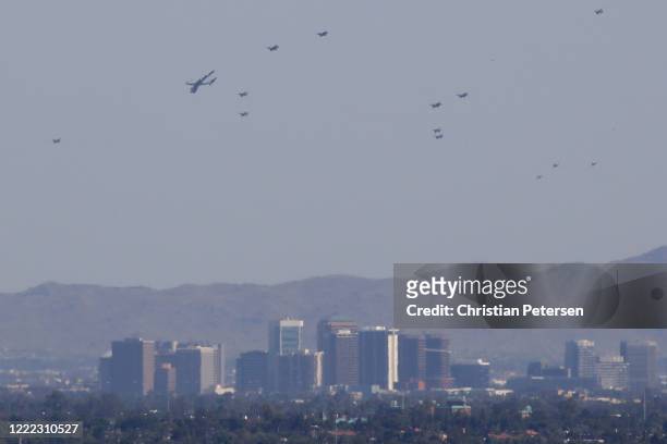 Luke AFB's 56th Fighter Wing and the 944th Fighter Wing and Arizona National Guard's 161st Air Refueling Wing flyover downtown Phoenix seen from atop...