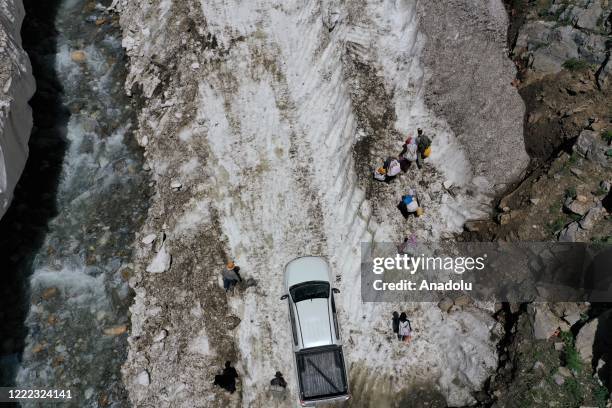 Drone photo shows an aerial view of Milkmaid women on their way to reach the villages for milking as Van metropolitan municipality staff conducts...