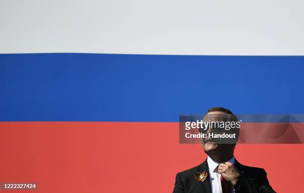 Deputy Chairman of the Security Council Dmitry Medvedev looks on prior to the Victory Day military parade in Red Square marking the 75th anniversary...