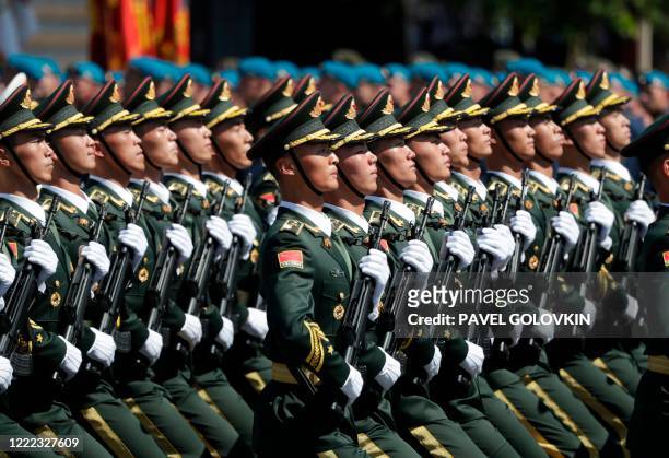 Soldiers from China's People's Liberation Army march on Red Square during a military parade, which marks the 75th anniversary of the Soviet victory...