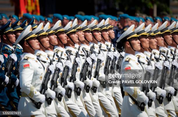 Soldiers from China's People's Liberation Army march on Red Square during a military parade, which marks the 75th anniversary of the Soviet victory...