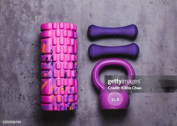 exercise equipment-kettlebell, dumbbell and foam roller - bodybuilder isolated stock-fotos und bilder