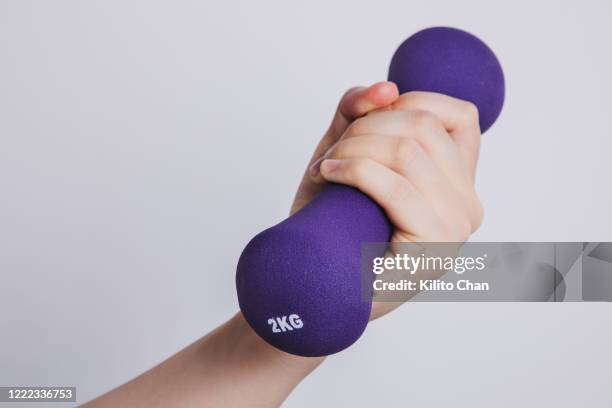 woman lifting kettlebell - womens hand weights stock pictures, royalty-free photos & images