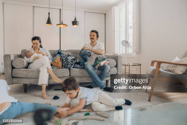 family in messy house while in quarantine for covid-19 - fight illness stock pictures, royalty-free photos & images