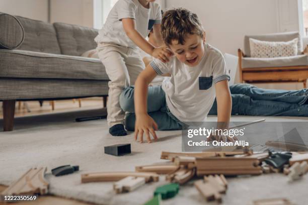 boys fighting while in quarantine fro covid-19 - sibling fight stock pictures, royalty-free photos & images