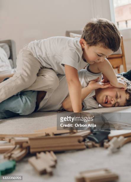 boys fighting while in quarantine fro covid-19 - sibling stock pictures, royalty-free photos & images