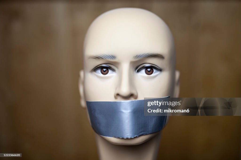 Mannequin dummy head with taped mouth