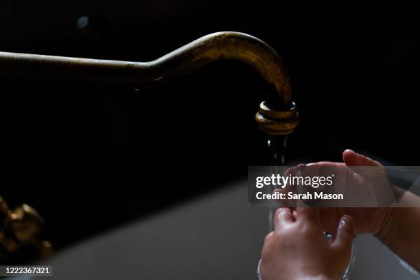 close up of hand washing at kitchen sink - washing hands close up stock pictures, royalty-free photos & images
