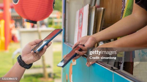 contactless concept. pay by smartphone - food truck payments stock pictures, royalty-free photos & images