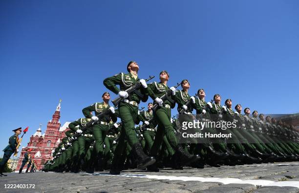 Servicemen march during a Victory Day military parade in Red Square marking the 75th anniversary of the victory in World War II, on June 24, 2020 in...