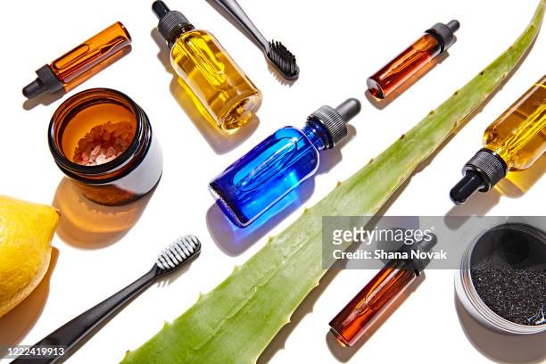 natural skincare products on a grid - skin care ingredients stock pictures, royalty-free photos & images