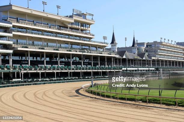 View of the twin spires and empty grandstand from the first turn at Churchill Downs on May 02, 2020 in Louisville, Kentucky. The 146th running of the...