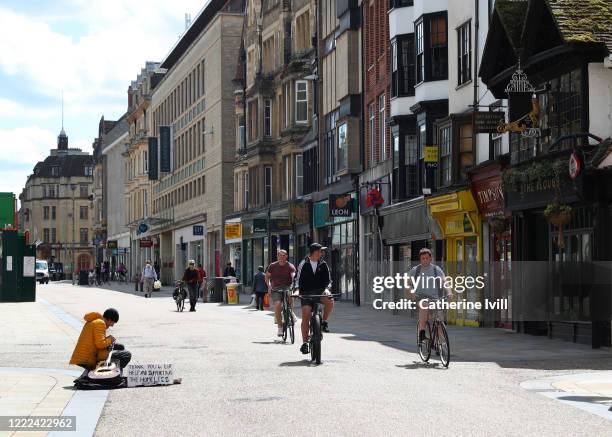 Homeless man busks on his guitar in the city centre on May 02, 2020 in Oxford, England. British Prime Minister Boris Johnson, who returned to Downing...