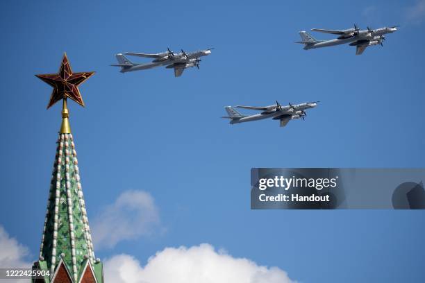 Tupolev Tu-95MS strategic bombers perform a flypast over Red Square during the Victory Day military parade marking the 75th anniversary of the...