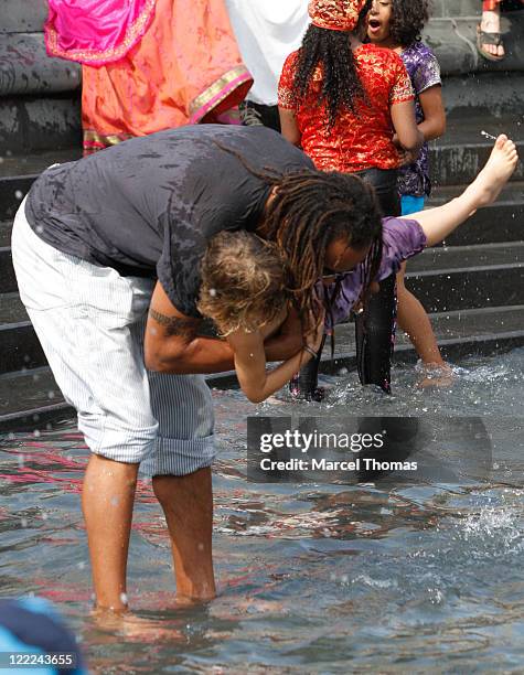 Tennis great Yannick Noah and son Joalukas Noah are seen at the fountain in Washington Square Park on June 12, 2010 in New York, New York.