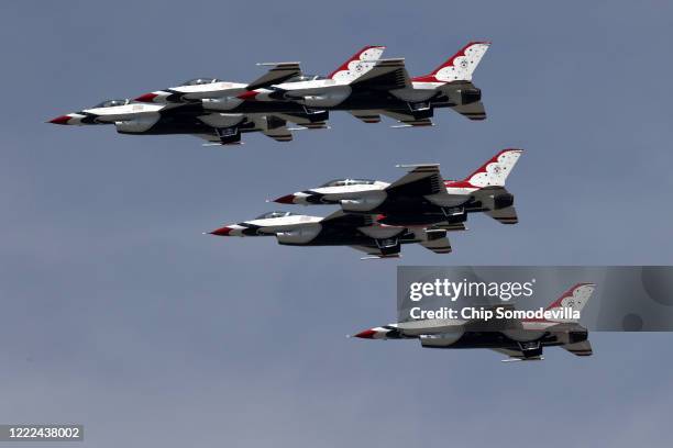 The U.S. Air Force Thunderbirds fly across the nation's capital during a tribute to healthcare workers, first responders, members of the military and...