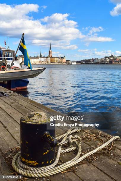 view of gamla stan old town from harbor of stockholm, sweden - stockholm summer stock-fotos und bilder