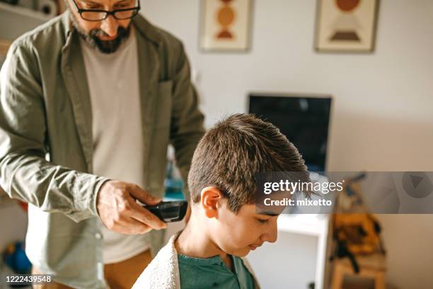 cutting hair with electric razor - shaving head stock pictures, royalty-free photos & images