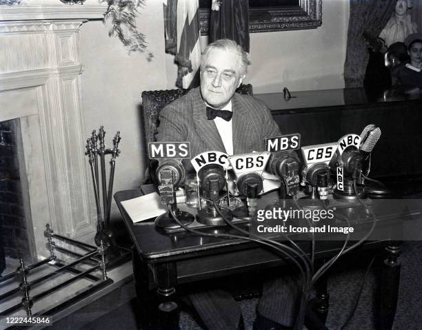 American politician who served as the 32nd president of the United States, Franklin Delano Roosevelt addresses the nation during a fireside chat two...