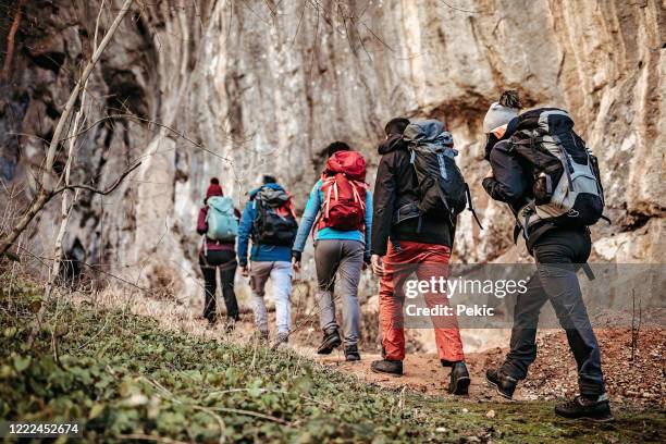 group of tourist on hiking tour - people climbing walking mountain group stock pictures, royalty-free photos & images