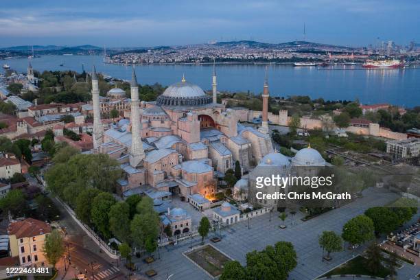 In this aerial photo from a drone, Istanbul's famous Hagia Sofia and surrounding gardens and pathways are seen empty during a weekend lockdown across...