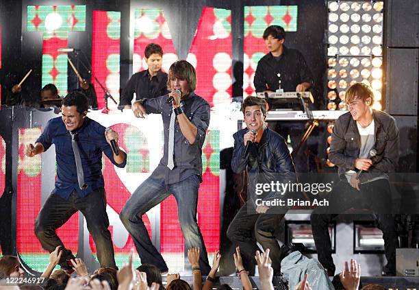 Carlos Pena, James Maslow, Logan Henderson and Kendall Schmidt of musical group Big Time Rush perform in Times Square on June 10, 2010 in New York...